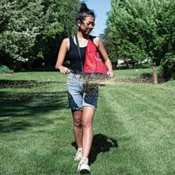 Earthway Hand Crank Spreader With 20lb Nylon Bag Hopper -Garden Care e27 inuse vert