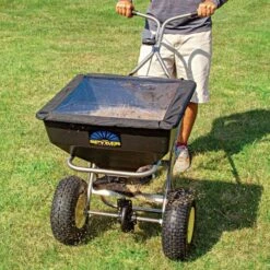 Spyker Ergo-Pro Spreader 80lb With Stainless Steel Frame 7 Spyker Ergo-Pro Spreader 80lb With Stainless Steel Frame -Garden Care spy80 1s inuse close